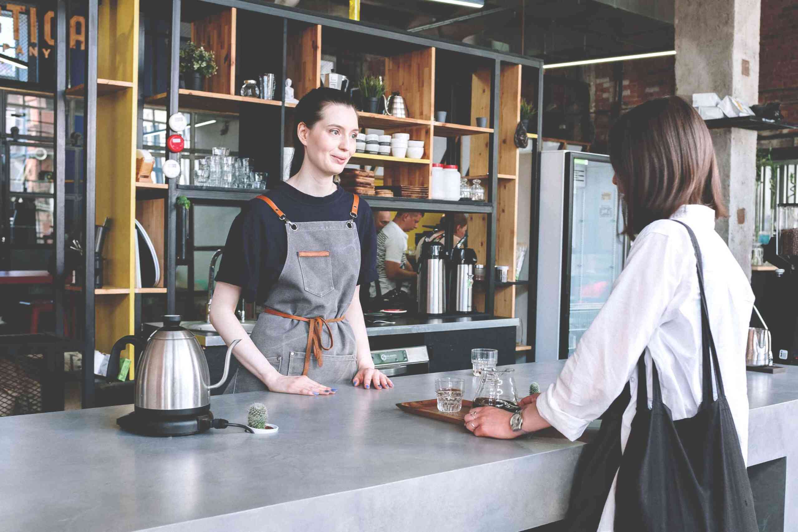 Coffee Shop Worker with Customer